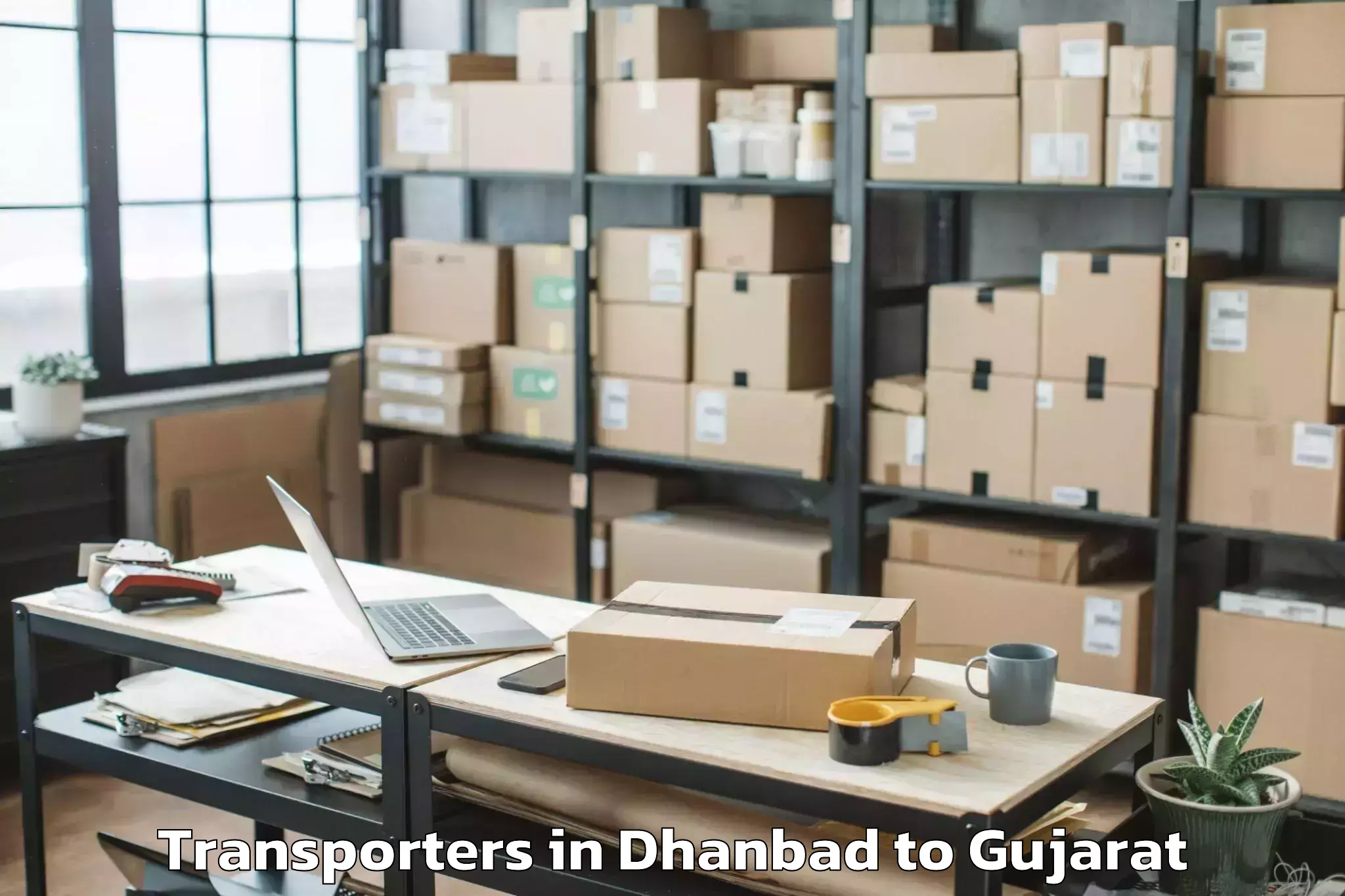 Book Dhanbad to Kadi Transporters Online